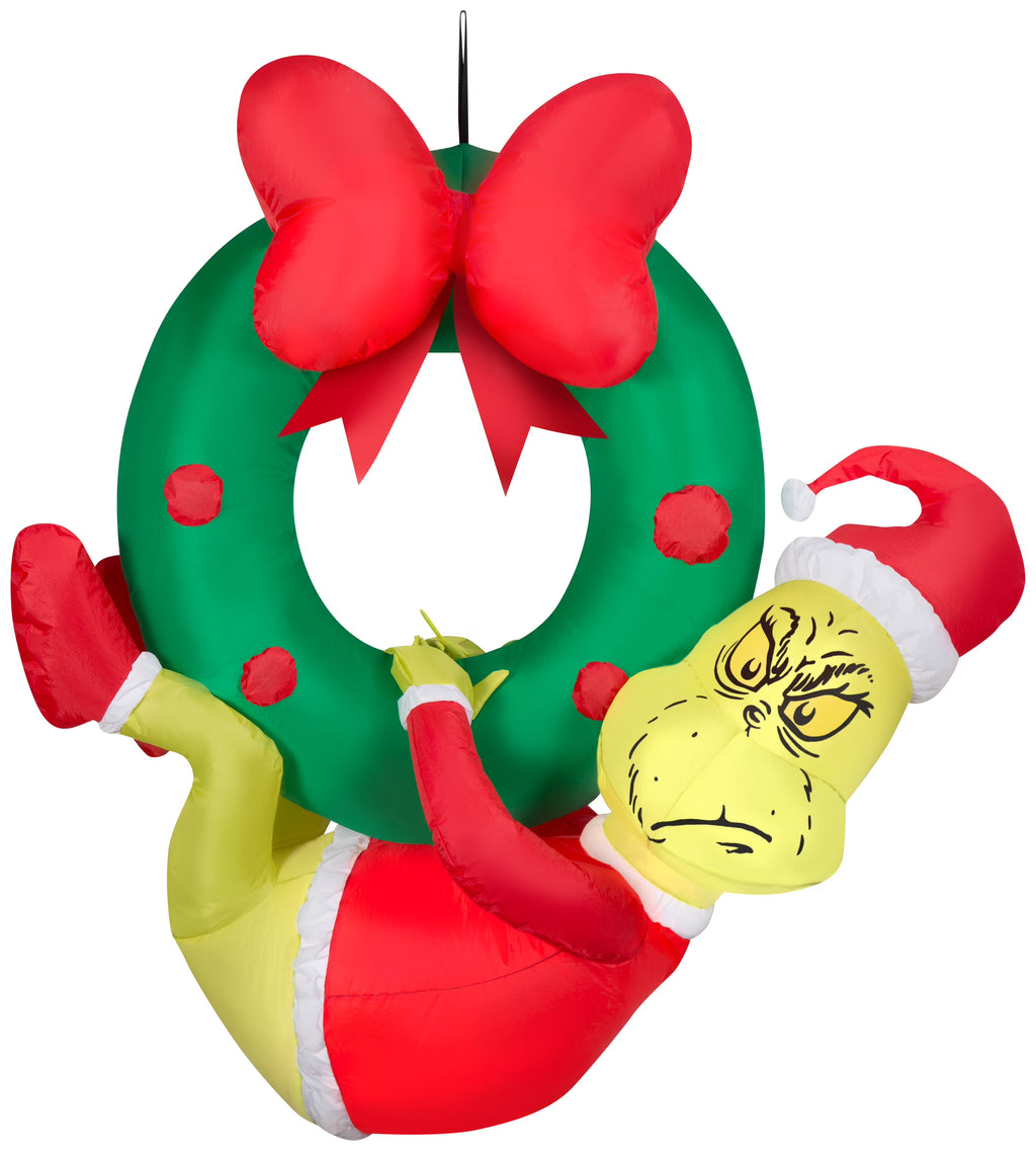 Green 4 ft Tall Inflatable Grinch Hanging from Wreath B303